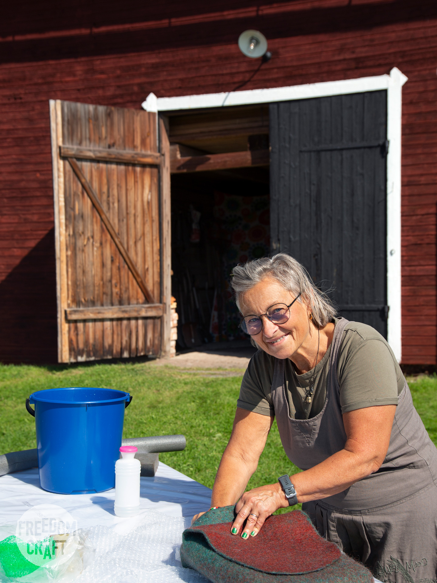 Participant working on a back pack project outside in the sun.